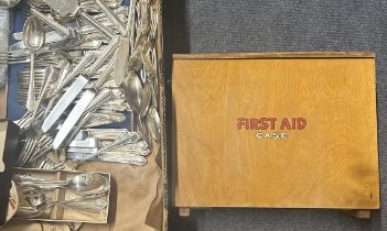 A vintage first aid kit and contents, assorted silver plate cutlery and flatware, and other items (