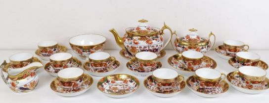 An early 19th century Spode 967 pattern tea service, deorated in an Imari pallet Crack inside teapot