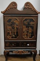 A lacquered cabinet, in the Chinese manner, 70 cm wide, two boxes and two Eastern carvings (5)