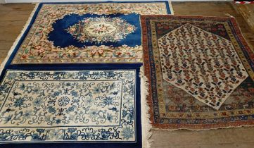 A Persian type rug, 175 x 135 cm, a Chinese rug, 160 x 92 cm, and a Chinese carpet, 215 x 140 (3)