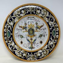 A pair of majolica pottery chargers, decorated floral forms, 43 cm diameter (2)