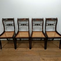 A set of four Regency style bar back dining chairs, with carved top rails (4)