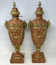 A pair of French style pink onyx cassolettes, with gilt metal mounts, 56 cm high (2) Generally all