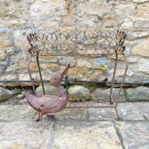 A wrought iron plant stand, and a duck (2)