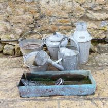 A galvanized metal watering can, a bucket, a plant pot, a three gallon jug, an urn and a small