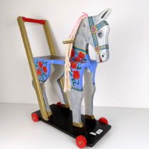 A painted push along horse, 61 cm high