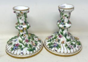A pair of porcelain candlesticks, decorated flowers, 117 cm high, and a part dessert service The