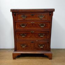 A reproduction walnut Bachelors chest, 60 cm wide