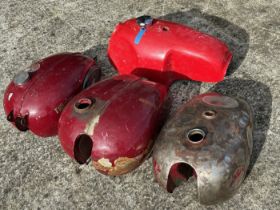 A Triumph petrol tank, and three other petrol tanks (4) Being sold without reserve Please note the