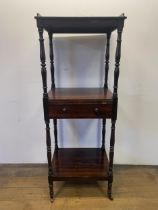 A 19th century rosewood whatnot, with a central drawer, raised on castors, 133 x 56 cm