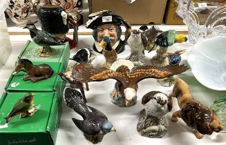 A Beswick eagle, a duck, assorted birds, and two character jugs (qty)