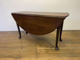 A 19th century mahogany drop leaf table, on turned legs to pad feet, 145 cm wide
