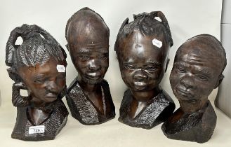 An African carved bust, of a lady, 39 cm high, and three others (4)