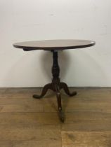 A mahogany wine table, on a tripod base, 76 cm diameter