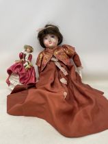 An early 20th century doll, restored, a Royal Doulton figure, assorted silver plated flatwares,