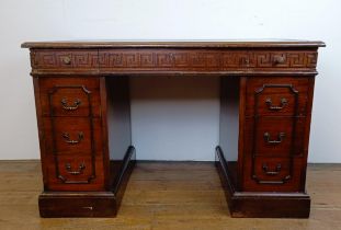 A mahogany kneehole desk, with a green tooled and gilt leather top, 127 cm wide Note: there are no