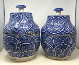 A pair of Moorish pottery style vases and covers, with blue glazed decoration, 35 cm high General