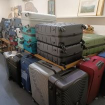A large group of assorted suitcases, various sizes, as removed from The Wincanton Cobblers 23