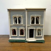 A painted dolls house, 73 cm high x 81 cm wide