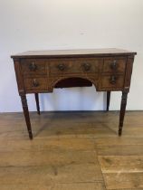 A 19th century mahogany enclosed dressing table, the hinged top to reveal a fitted interior, to