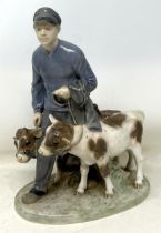 A Royal Copenhagen figure of a young man with two calves, 23 cm high No chips, cracks or restoration