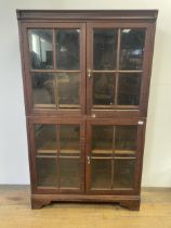 An oak glazed bookcase, by Morris & Company Art-Workers, label verso