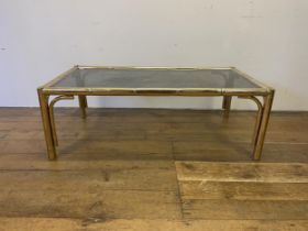 A brass and glass coffee table, 120 cm wide