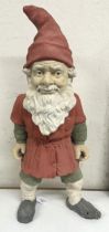 A pottery garden gnome, 62 cm high not concrete, terracotta type material age reportedly 19th