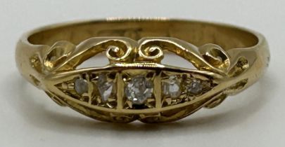 An 18ct gold and three stone diamond ring, ring size Q, in a vintage jewellery box