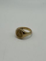 A 9ct gold Masonic signet ring, with an engraved revolving plaque, ring size T, 7.3 g