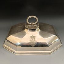 A George III silver meat dish cover, engraved a coat of arms and a motto underneath a coronet,
