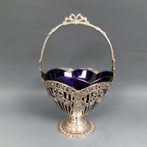 A French silver swing handled sugar bowl, with a blue glass liner 6.1 ozt