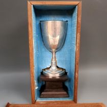 A Chinese silver coloured metal goblet, Wang Hing, 173 g, on a carved wooden base, cased