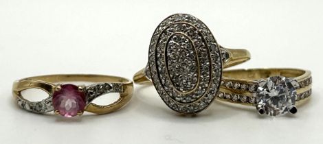 A 9ct gold and white stone ring, ring size I, and two other 9ct gold rings (3)