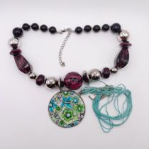 A duo of bead and disc dress necklaces