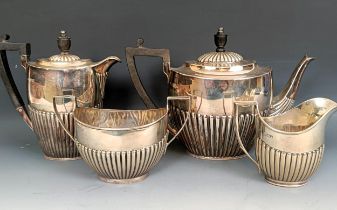 A George V silver four piece tea set, with ebonised handles, all in 37.2 g (4)