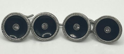 A set of four platinum, enamel and white stone dress buttons