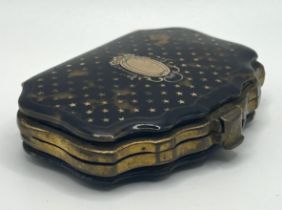 A late 19th/early 20th century tortoiseshell and gilt metal purse