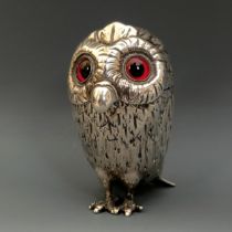 A silver coloured metal novelty mustard, in the form of an owl, with glass eyes, 9 cm high
