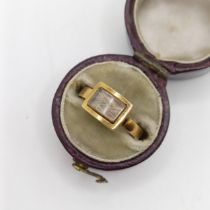 A 19th century memorial ring, inset with a lock of hair, in a vintage jewellery box Has come away on