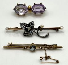 A 9ct gold and purple stone bar brooch, and two other bar brooches (3)