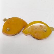 A pair of novelty amber and gilt metal cufflinks, in the form of fish