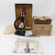 A vintage student's microscope, boxed