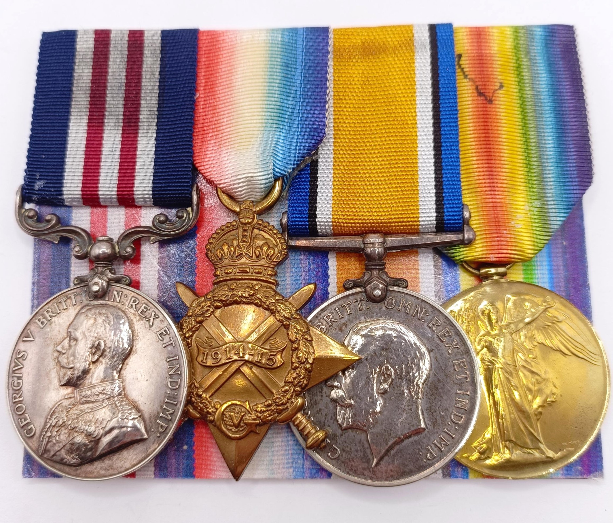A group of four medals, awarded to T4-069724 Cpl H Lloyd, 332/Coy ASC, and a 1914-15 Star Trio