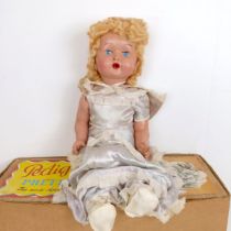 A Pedigree Pretty Peepers doll, boxed, a Vulcan child's sewing machine, boxed, and assorted dolls (2