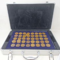 A group of assorted GB coins, in a coin case