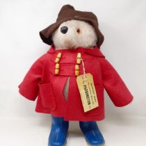 A vintage Paddington bear, with a brown hat and blue wellington boots