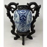 A blue and white Delft vase and cover, 30 cm high, and another with a Chinese style wooden mount (2)