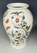 A Portmeirion Botanic Garden vase, 18cm high, a matching bowl and flan dish, 30 cm diameter, and