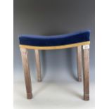 An Elizabeth II Coronation stool, the blue velvet seat on limed oak chamfered legs, stamped